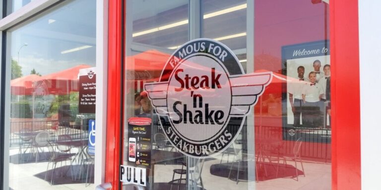 A view of a store front sign for the burger chain known as Steak n Shake. gID 7